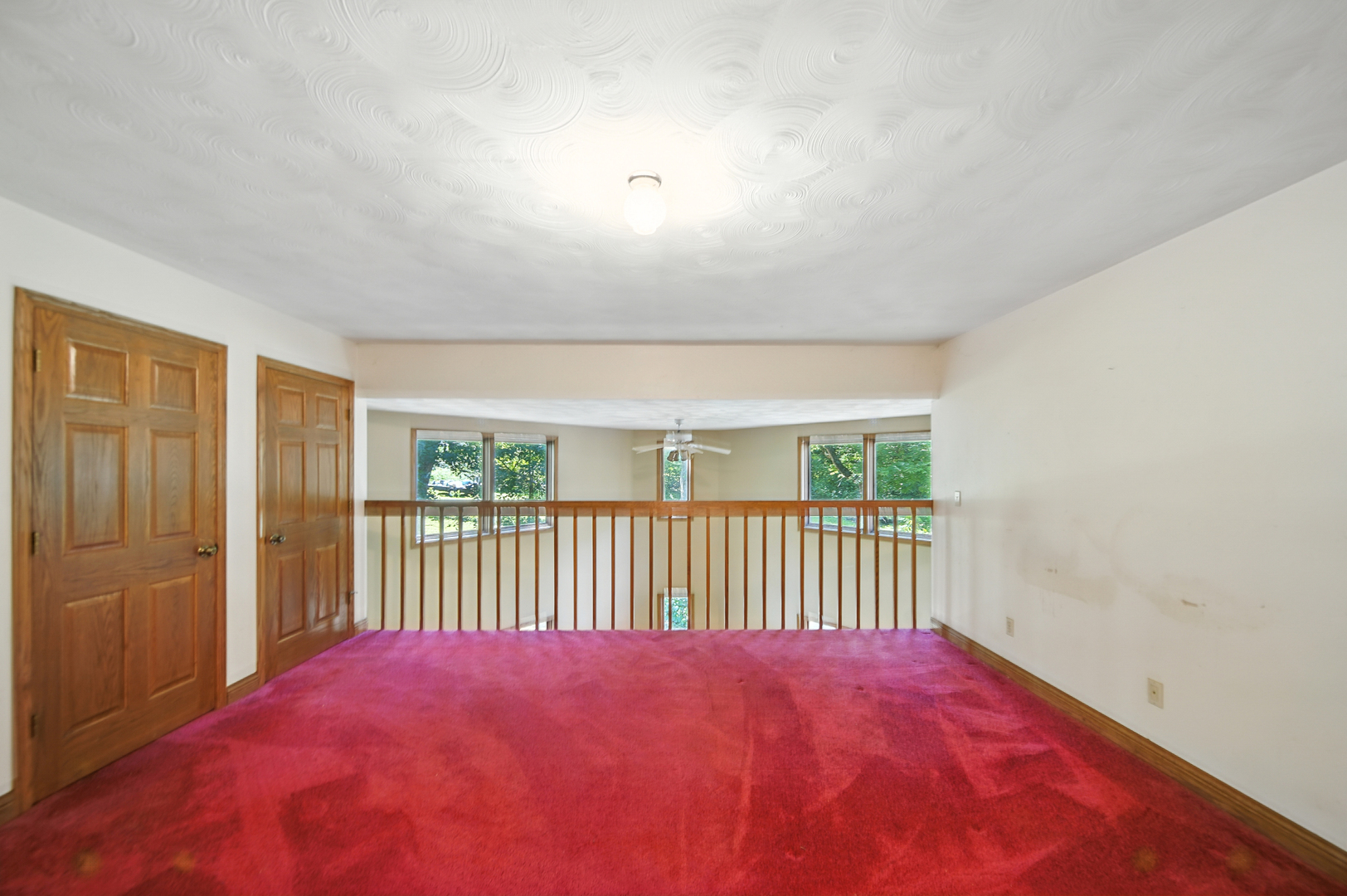 21631 Hoover Road Sterling, IL 61081 - Photo 19 of 30 a view of a bedroom with wooden floor and a window