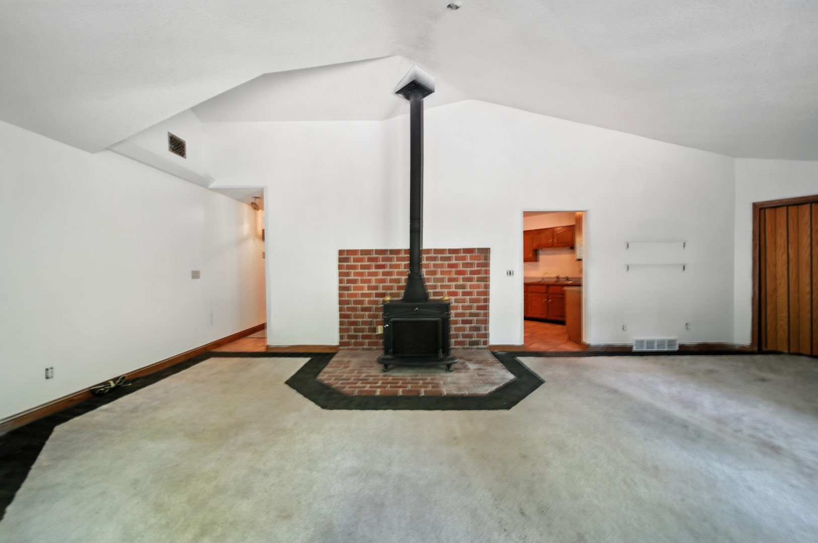 21631 Hoover Road Sterling, IL 61081 - Photo 10 of 30 a view of an empty room with a fireplace
