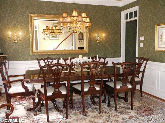 1207 Goswick Ridge Road Midlothian, VA 23114 - Photo 6 of 12 a view of a dining room with furniture and wooden floor
