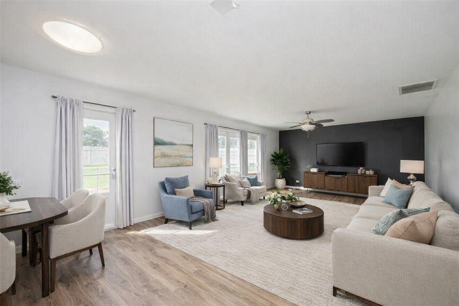 2534 Halstead Drive Spring, TX 77386 - Photo 3 of 35 a living room with furniture a flat screen tv and a large window