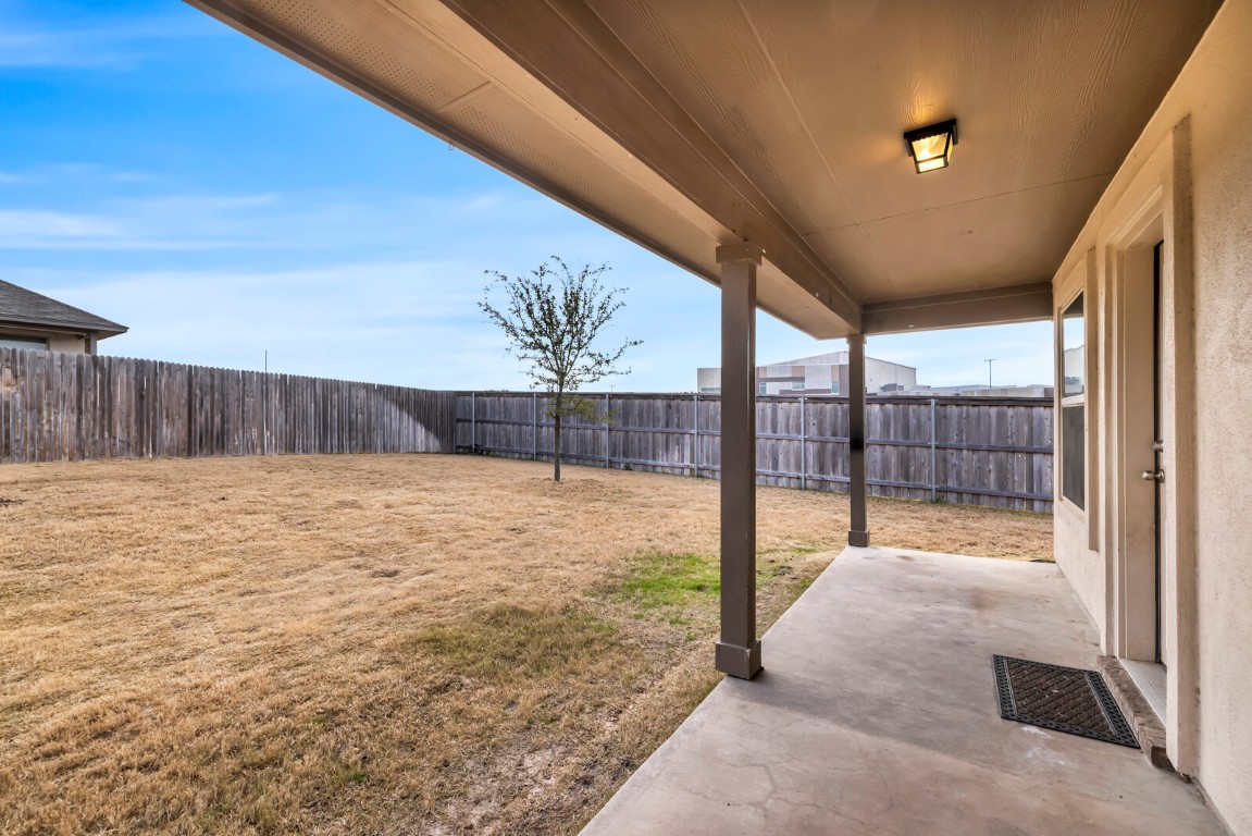 539 Merlin Lane Leander, TX 78641 - Photo 17 of 18 Fenced backyard featuring a patio