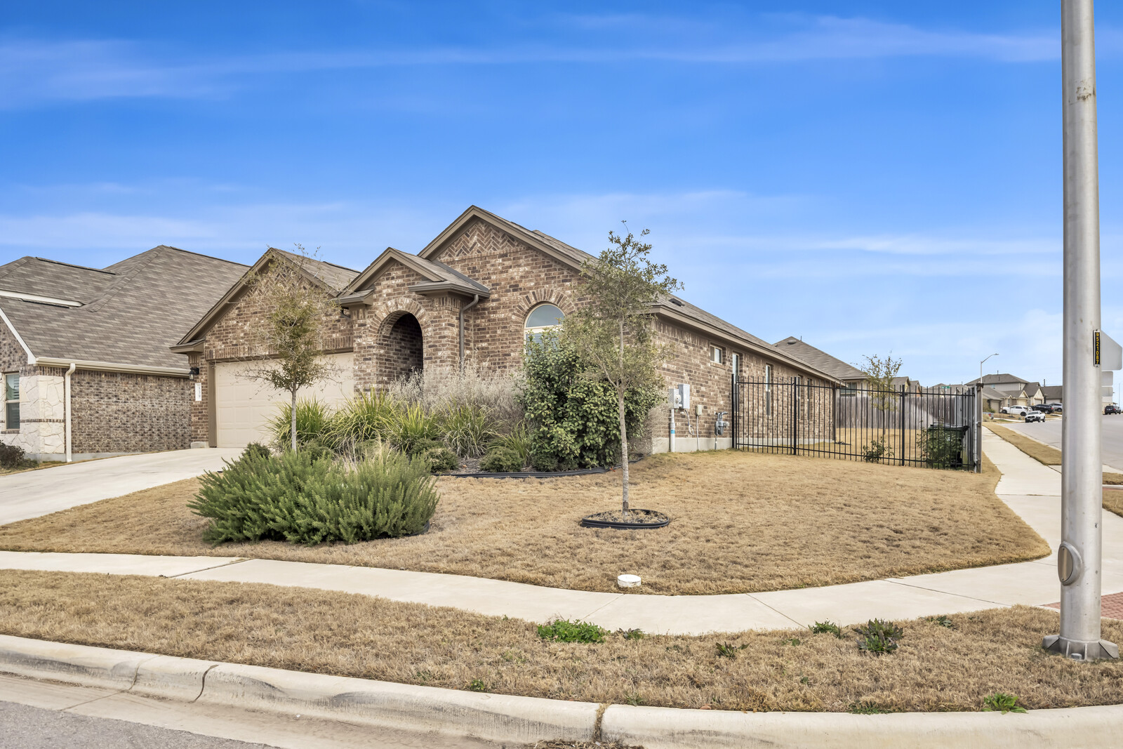 539 Merlin Lane Leander, TX 78641 - Photo 2 of 18 a front view of a house with a yard
