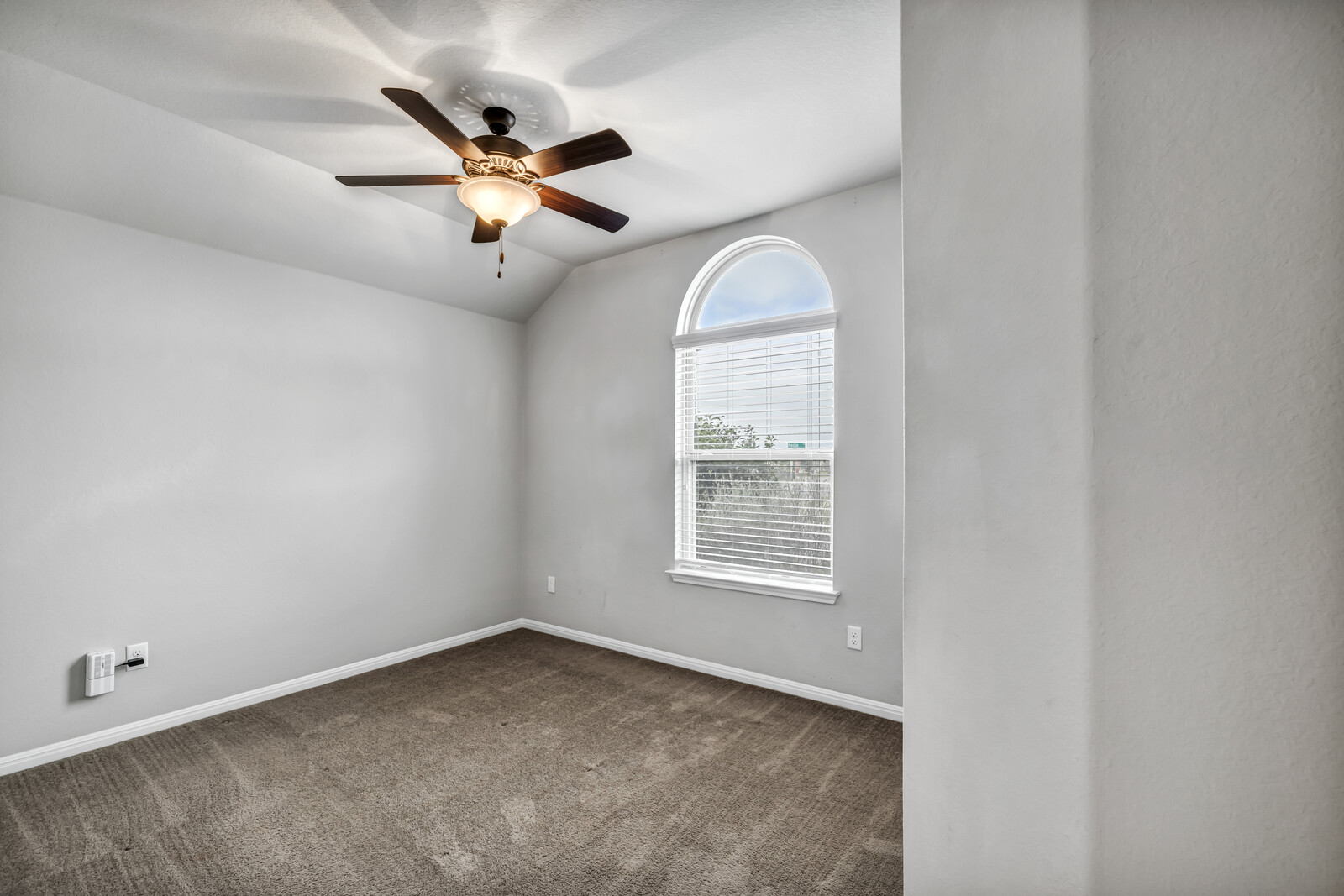 539 Merlin Lane Leander, TX 78641 - Photo 3 of 18 an empty room with ceiling fan and window