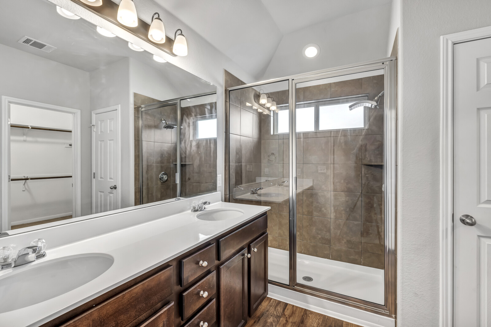 539 Merlin Lane Leander, TX 78641 - Photo 10 of 18 a bathroom with a shower sink and mirror