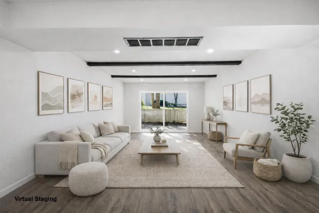 a living room with furniture and window