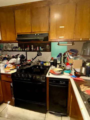 a kitchen with a stove and a sink