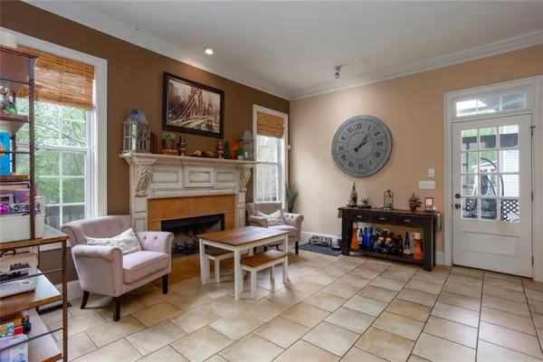 a living room with furniture a window and gym equipment