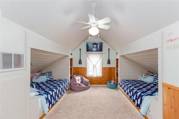 a view of a big house with a big yard and large trees