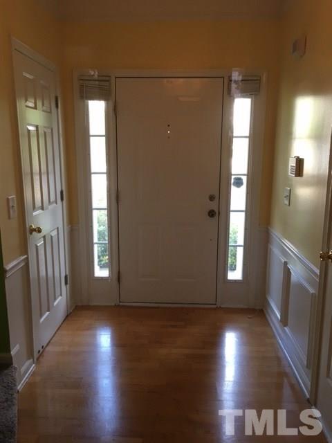 7010 Mead Lane Raleigh, NC 27613 - Photo 3 of 22 an empty room with wooden floor and windows