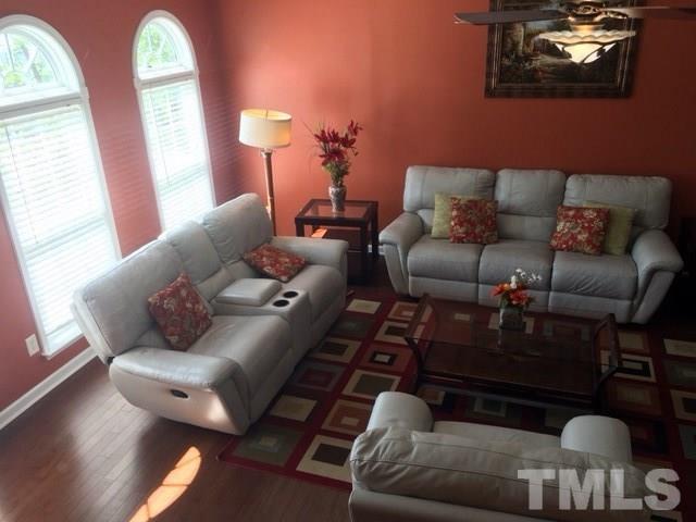 7010 Mead Lane Raleigh, NC 27613 - Photo 6 of 22 a living room with furniture and wooden floor