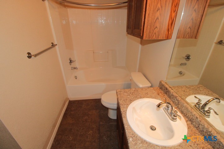 911 Brookview Drive, Unit A Copperas Cove, TX 76522 - Photo 11 of 13 a bathroom with a sink and a toilet