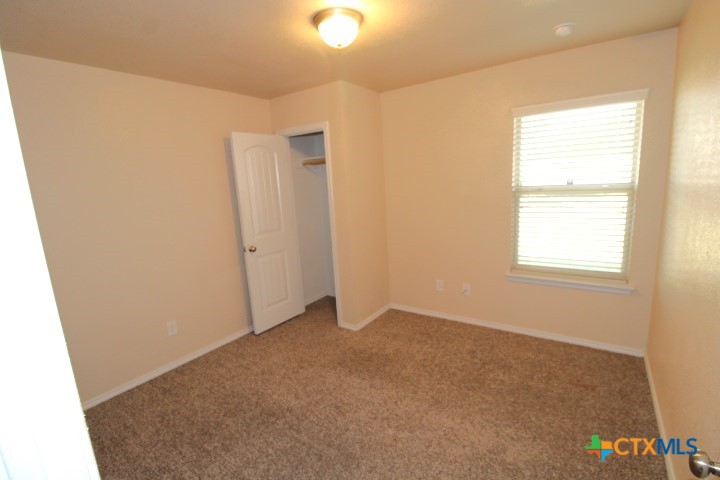 911 Brookview Drive, Unit A Copperas Cove, TX 76522 - Photo 5 of 13 a view of an empty room with a window