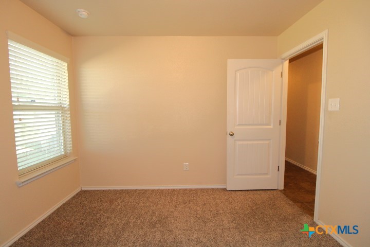 911 Brookview Drive, Unit A Copperas Cove, TX 76522 - Photo 6 of 13 an empty room with windows