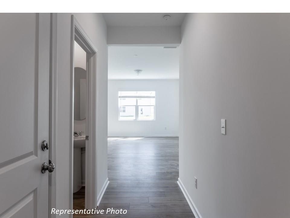 1248 Maple Shade Road Southwest, Unit 74 Concord, NC 28027 - Photo 4 of 11 a view of hallway with a bathroom