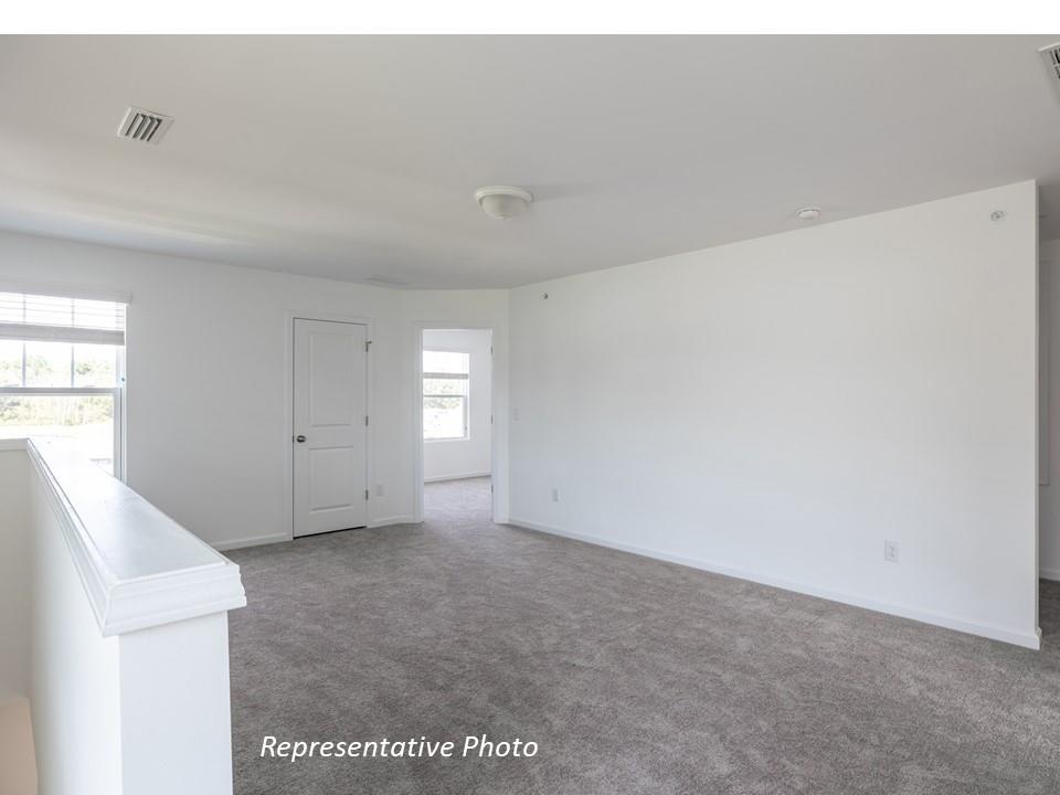 1248 Maple Shade Road Southwest, Unit 74 Concord, NC 28027 - Photo 6 of 11 a view of an empty room with a window