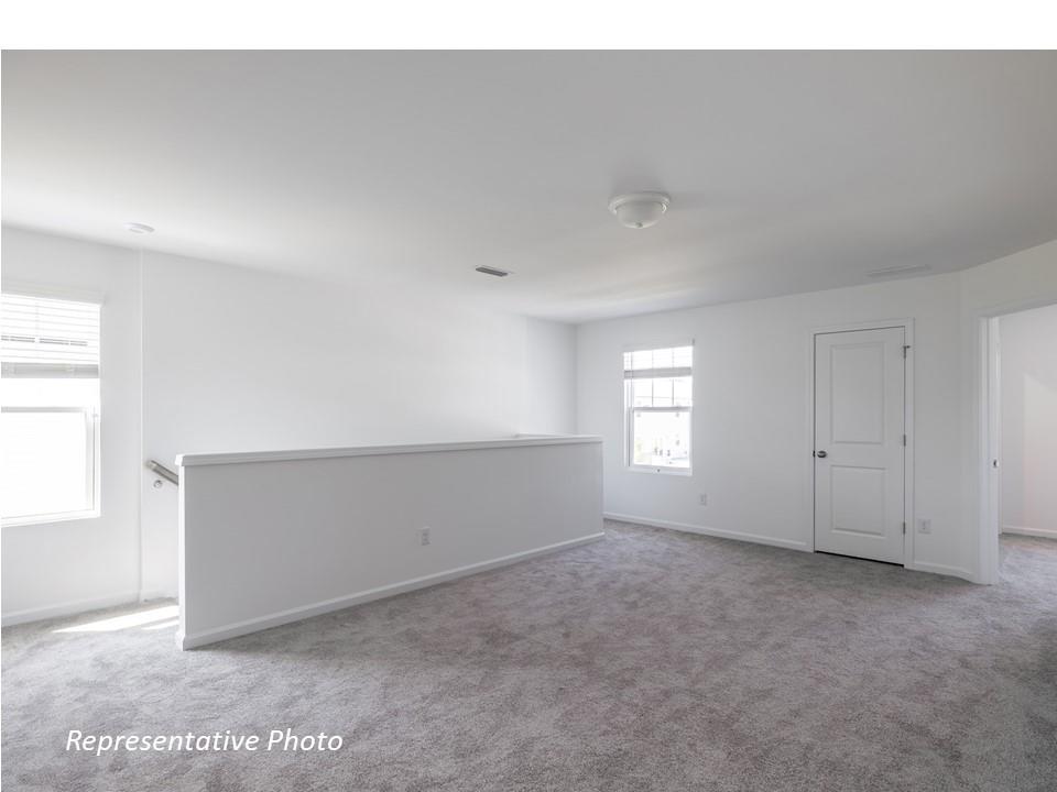 1248 Maple Shade Road Southwest, Unit 74 Concord, NC 28027 - Photo 7 of 11 a view of an empty room and window