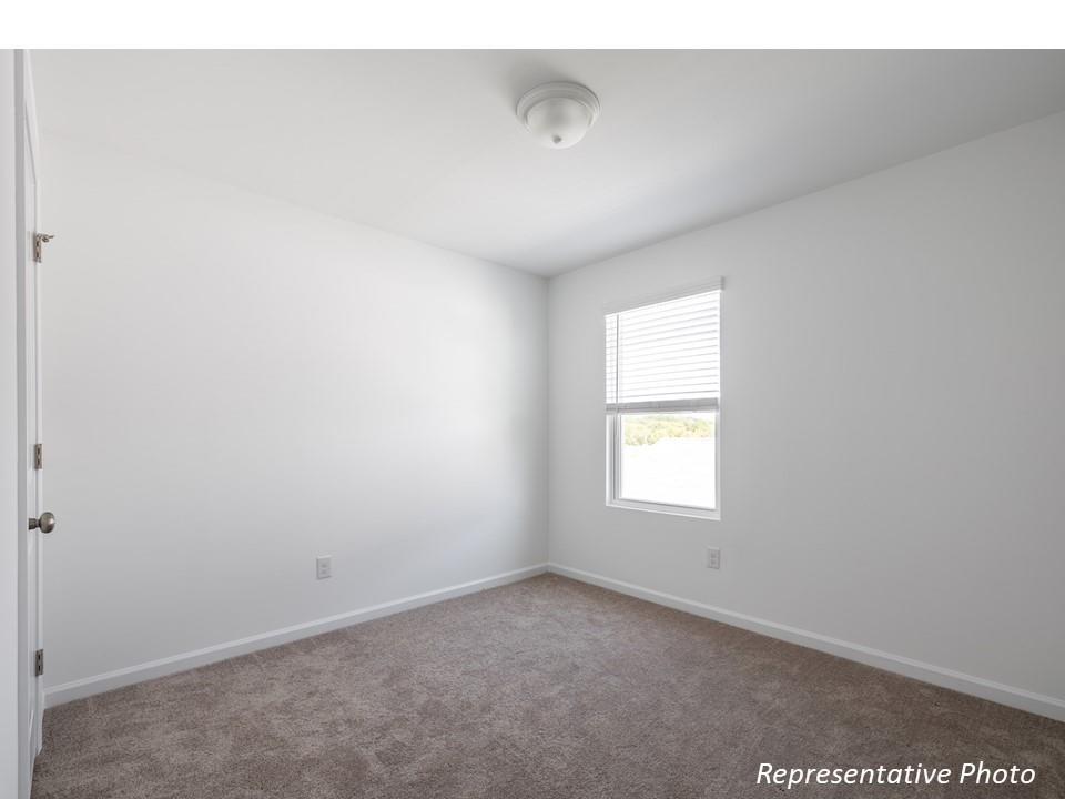 1248 Maple Shade Road Southwest, Unit 74 Concord, NC 28027 - Photo 8 of 11 a view of empty room with window