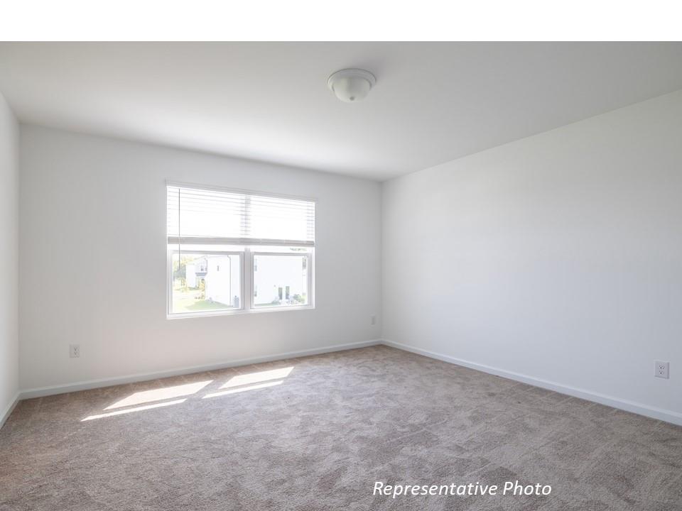 1248 Maple Shade Road Southwest, Unit 74 Concord, NC 28027 - Photo 10 of 11 an empty room with a window
