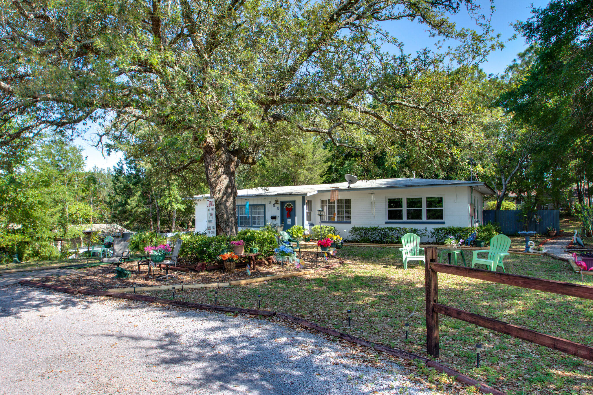 333 Edge Avenue Valparaiso, FL 32580 - Photo 2 of 37 a front view of a house with a yard and tree s