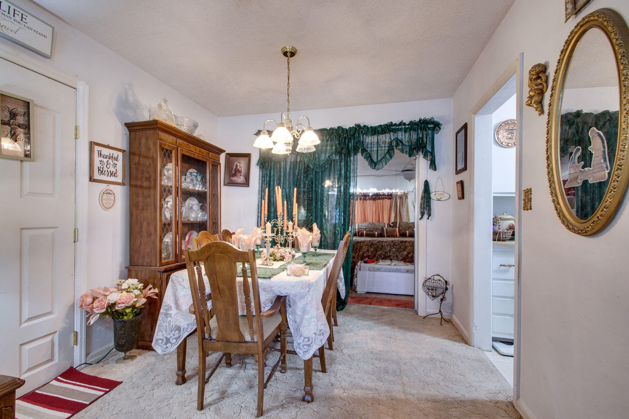 333 Edge Avenue Valparaiso, FL 32580 - Photo 12 of 37 a view of a dining room with furniture and chandelier