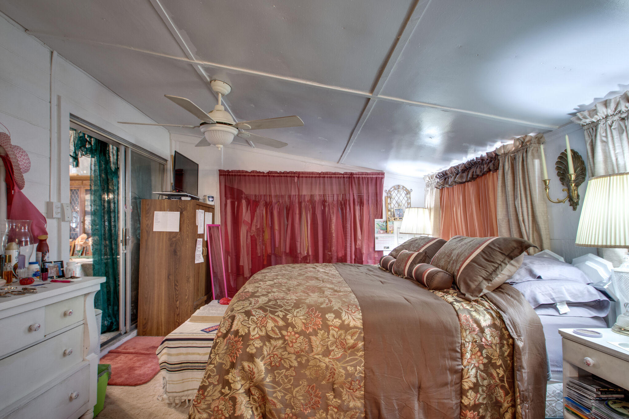 333 Edge Avenue Valparaiso, FL 32580 - Photo 16 of 37 a bedroom with a bed mirror and a window