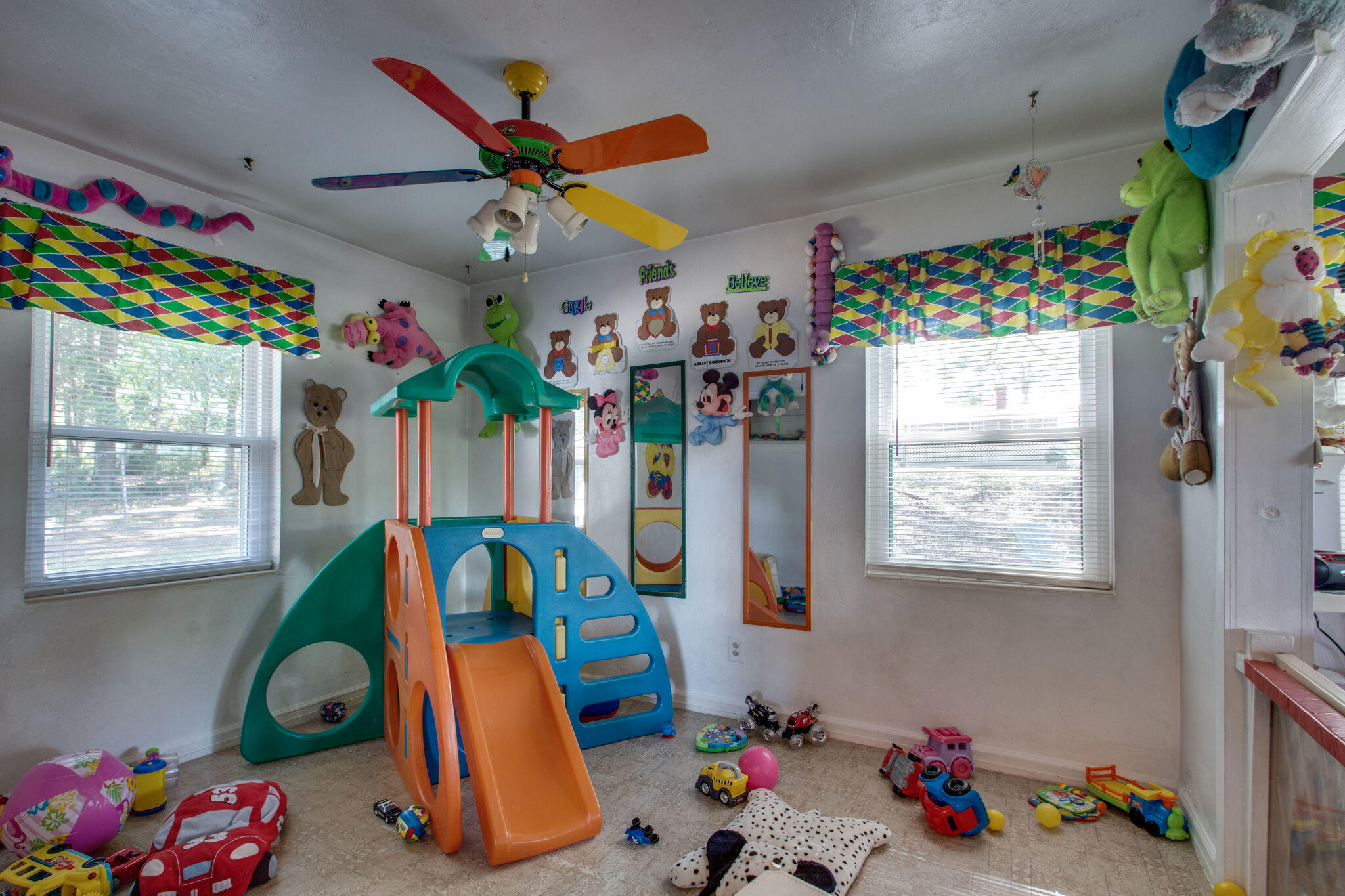 333 Edge Avenue Valparaiso, FL 32580 - Photo 20 of 37 a play room with toys and a chandelier