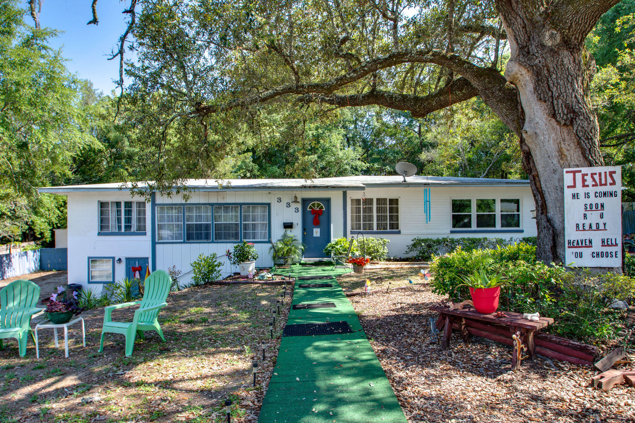 333 Edge Avenue Valparaiso, FL 32580 - Photo 3 of 37 a front view of a house with garden and porch
