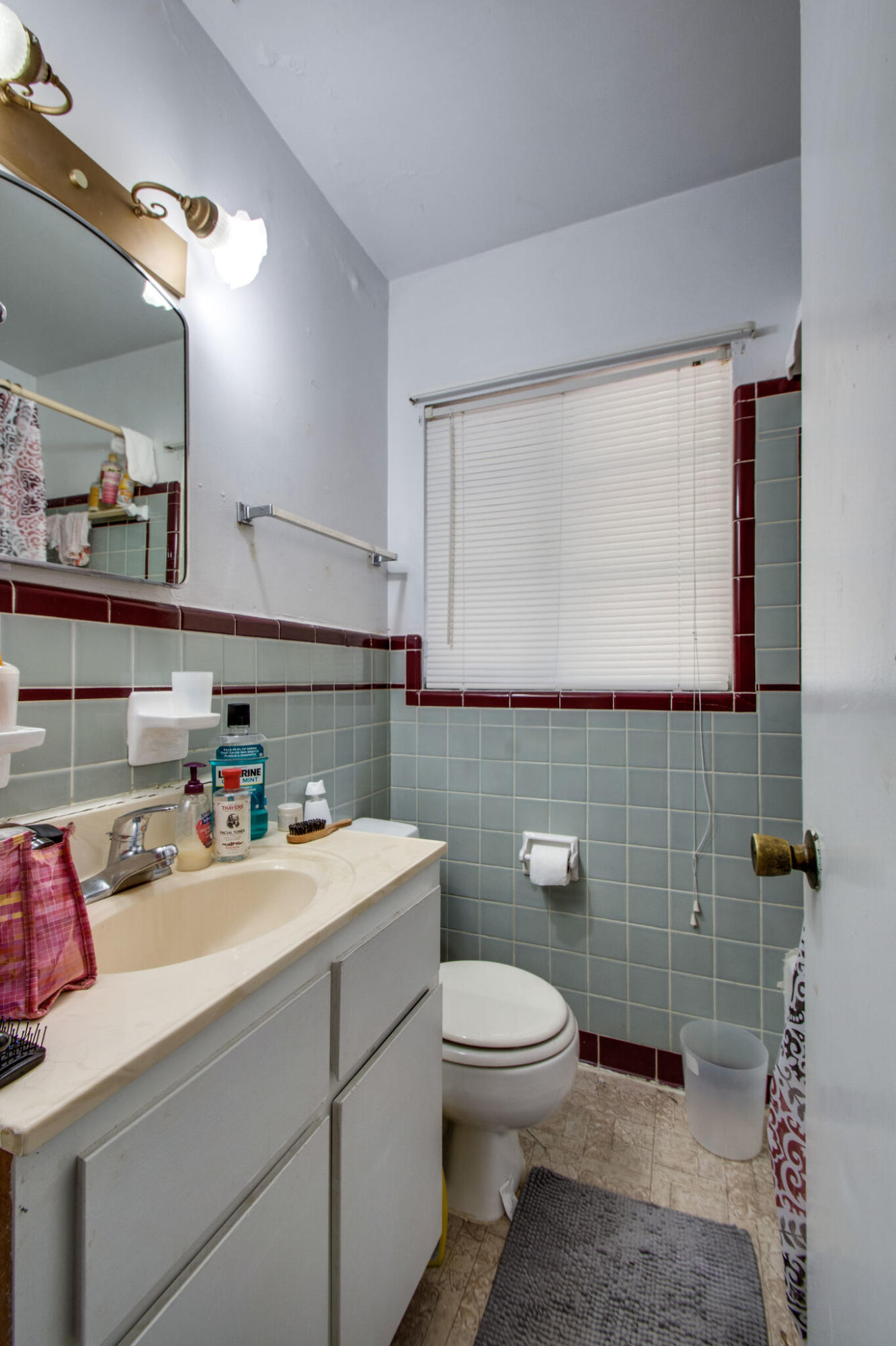 333 Edge Avenue Valparaiso, FL 32580 - Photo 24 of 37 a bathroom with a sink a toilet and mirror