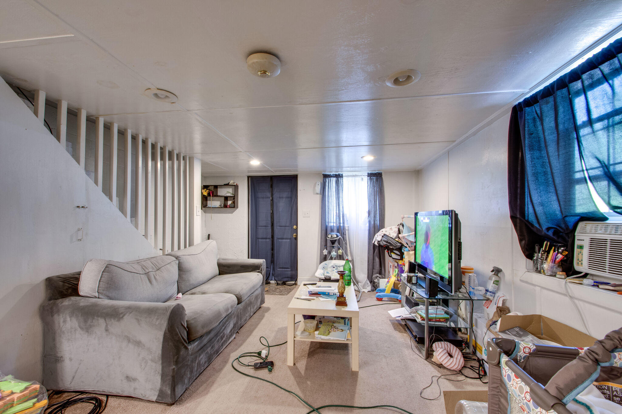 333 Edge Avenue Valparaiso, FL 32580 - Photo 26 of 37 a living room with furniture and a chandelier
