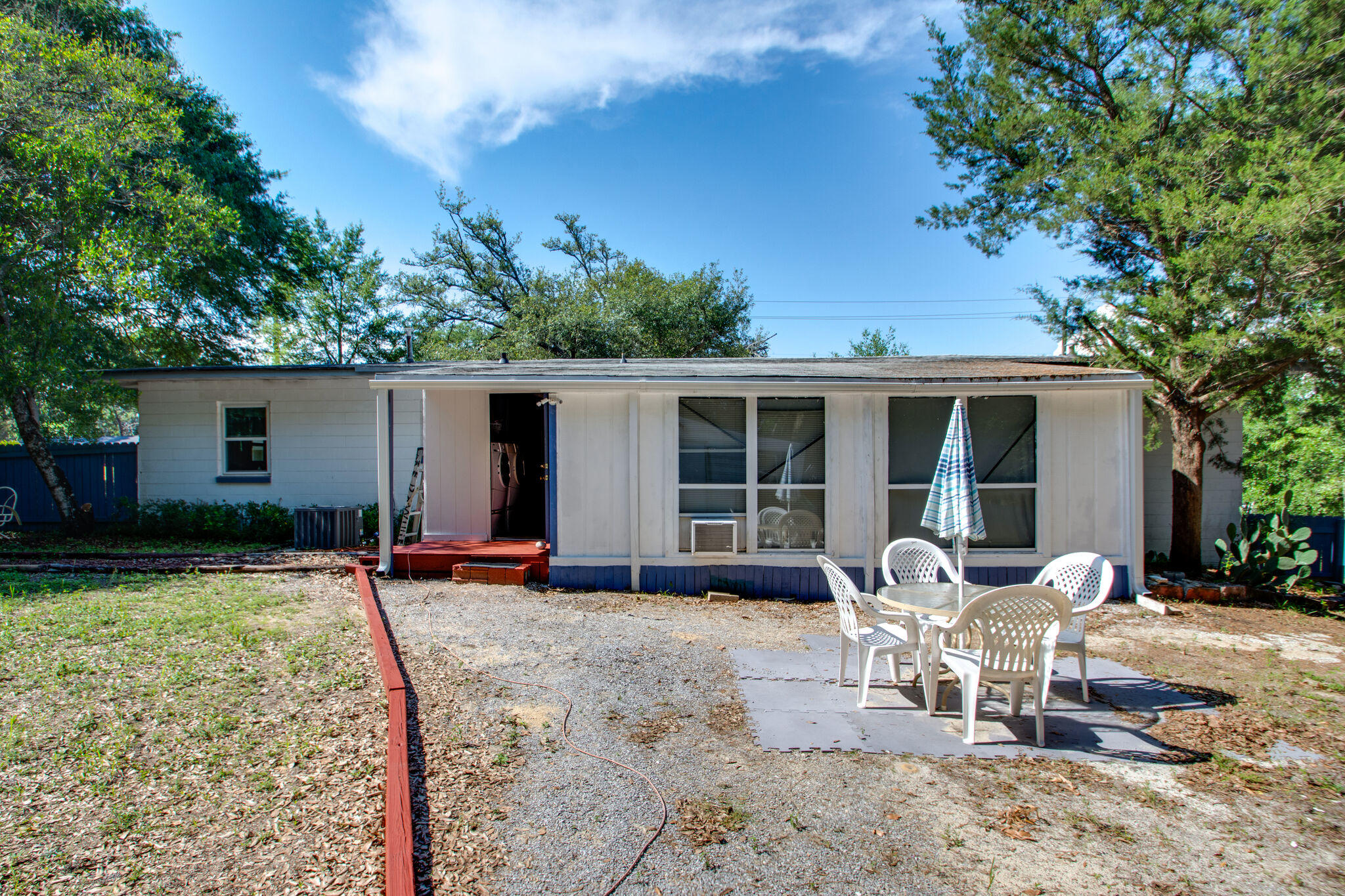 333 Edge Avenue Valparaiso, FL 32580 - Photo 29 of 37 a view of a house with backyard sitting area and garden