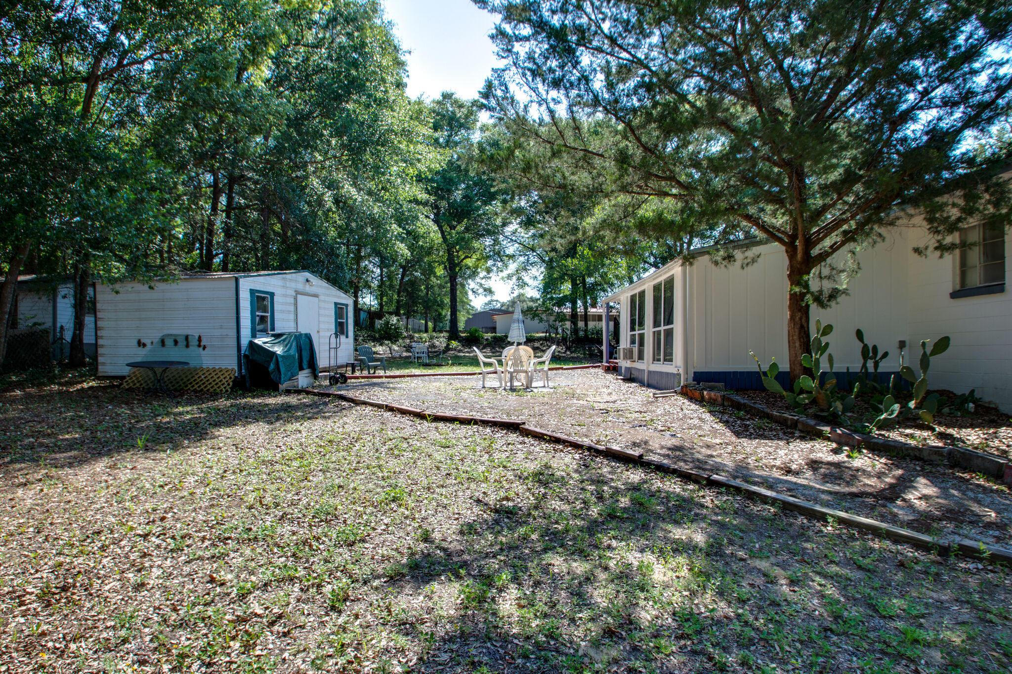 333 Edge Avenue Valparaiso, FL 32580 - Photo 31 of 37 a view of house with backyard and trees
