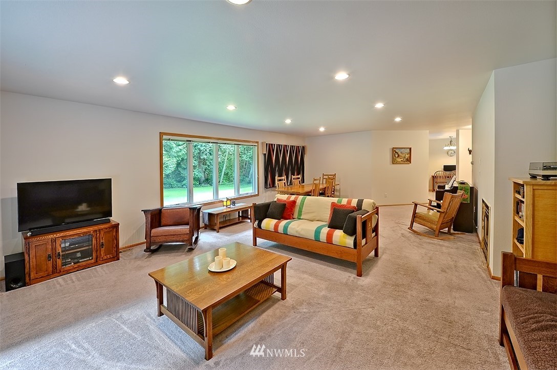 4192 West Road Blaine, WA 98230 - Photo 12 of 27 a living room with furniture and a flat screen tv