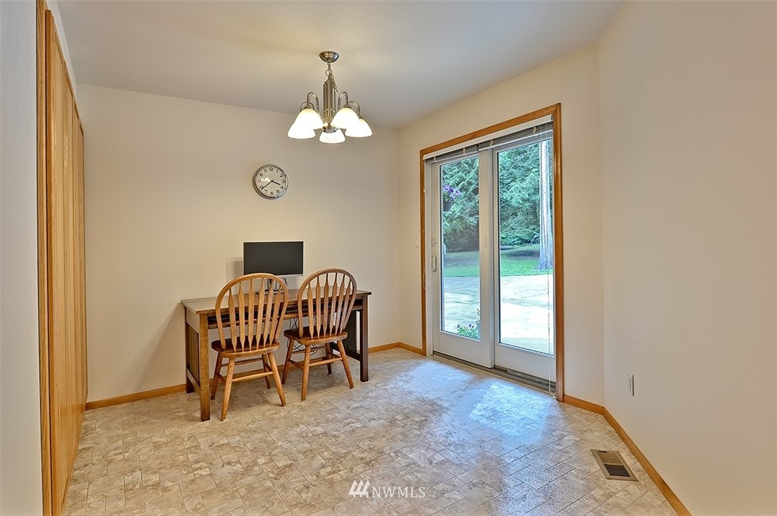 4192 West Road Blaine, WA 98230 - Photo 15 of 27 a view of a livingroom with a chair and dining table