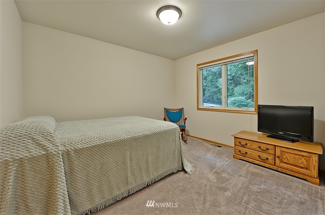 4192 West Road Blaine, WA 98230 - Photo 19 of 27 a living room with furniture and a flat screen tv