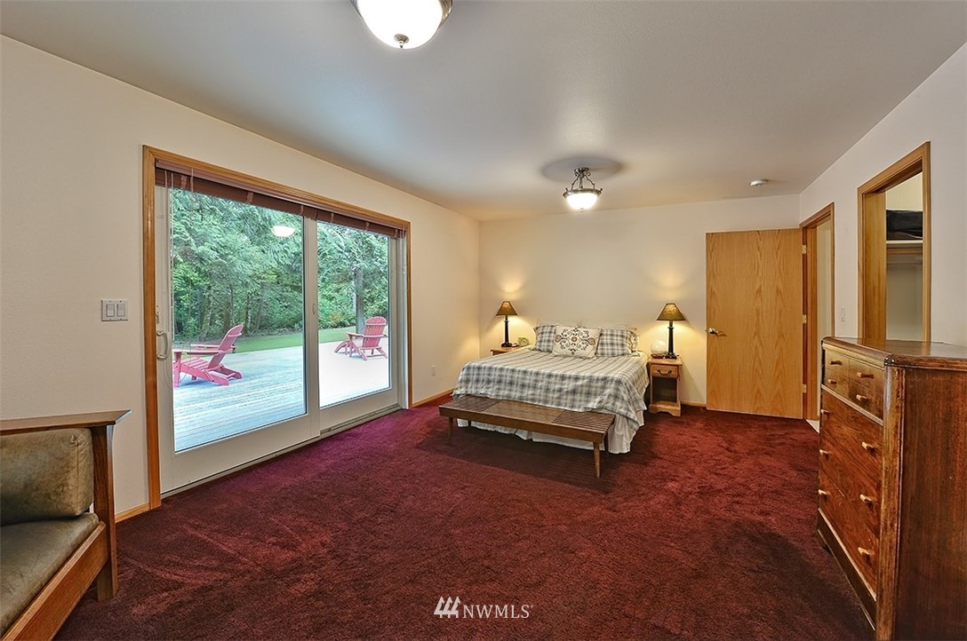 4192 West Road Blaine, WA 98230 - Photo 20 of 27 a bedroom with a bed and large window