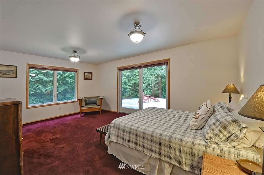 4192 West Road Blaine, WA 98230 - Photo 21 of 27 a bedroom with a bed and a large window
