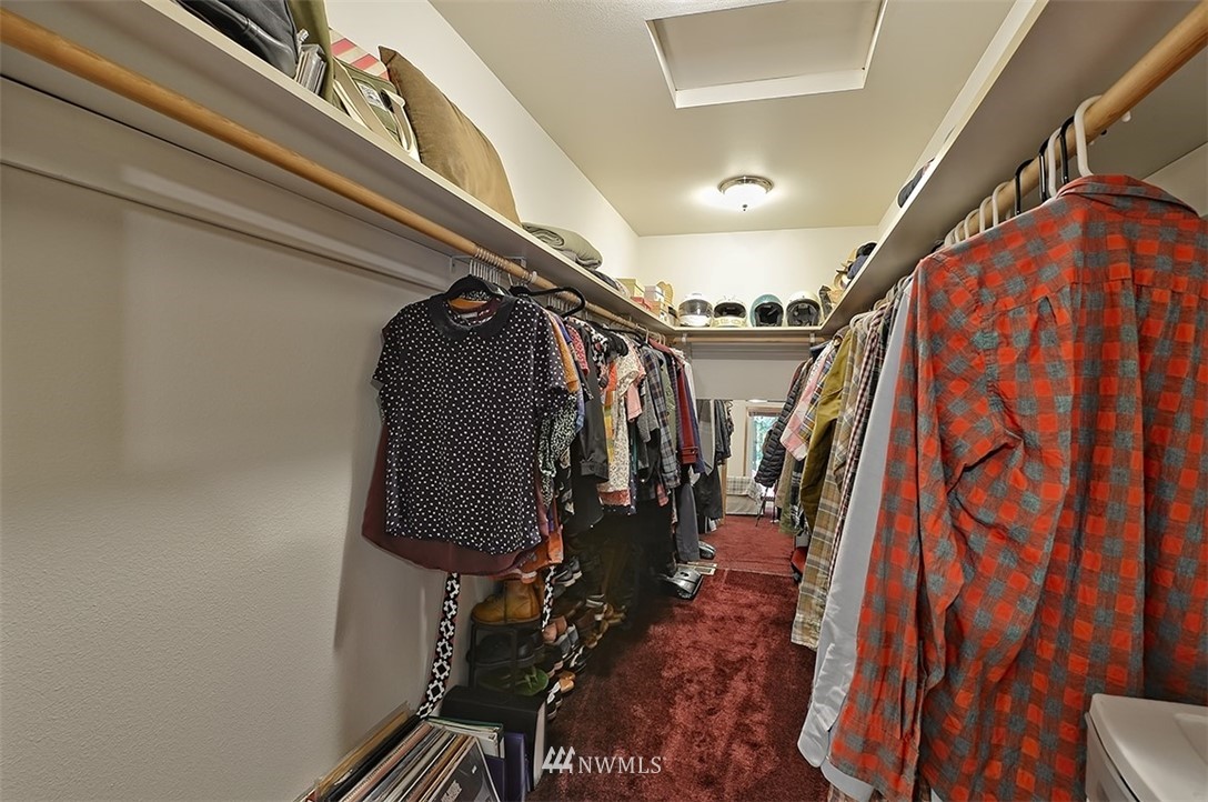 4192 West Road Blaine, WA 98230 - Photo 22 of 27 a view of walk in closet with clothes and shoes