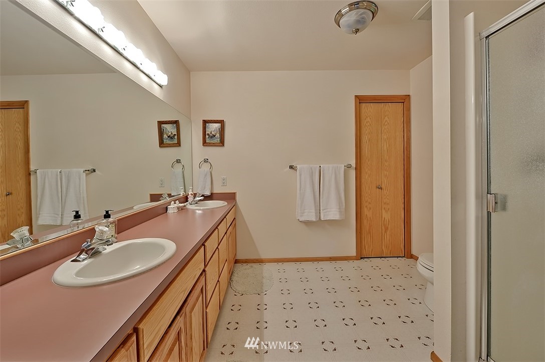 4192 West Road Blaine, WA 98230 - Photo 23 of 27 a bathroom with a sink double vanity and a mirror