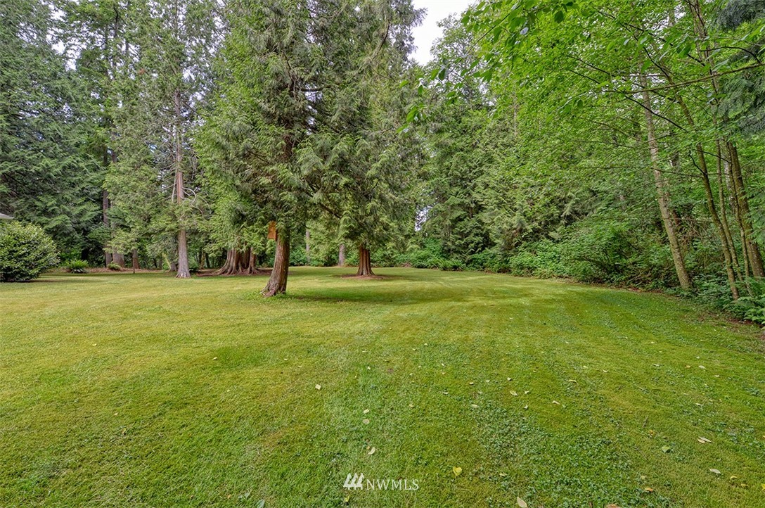 4192 West Road Blaine, WA 98230 - Photo 26 of 27 a view of outdoor space with garden and trees