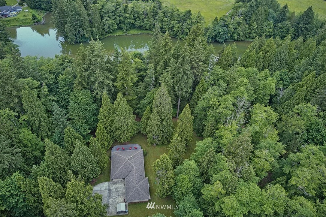 4192 West Road Blaine, WA 98230 - Photo 4 of 27 an aerial view of a house with a yard and lake view