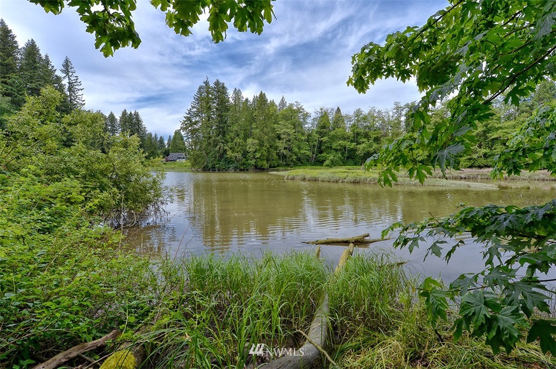 4192 West Road Blaine, WA 98230 - Photo 6 of 27 a lake view with a garden