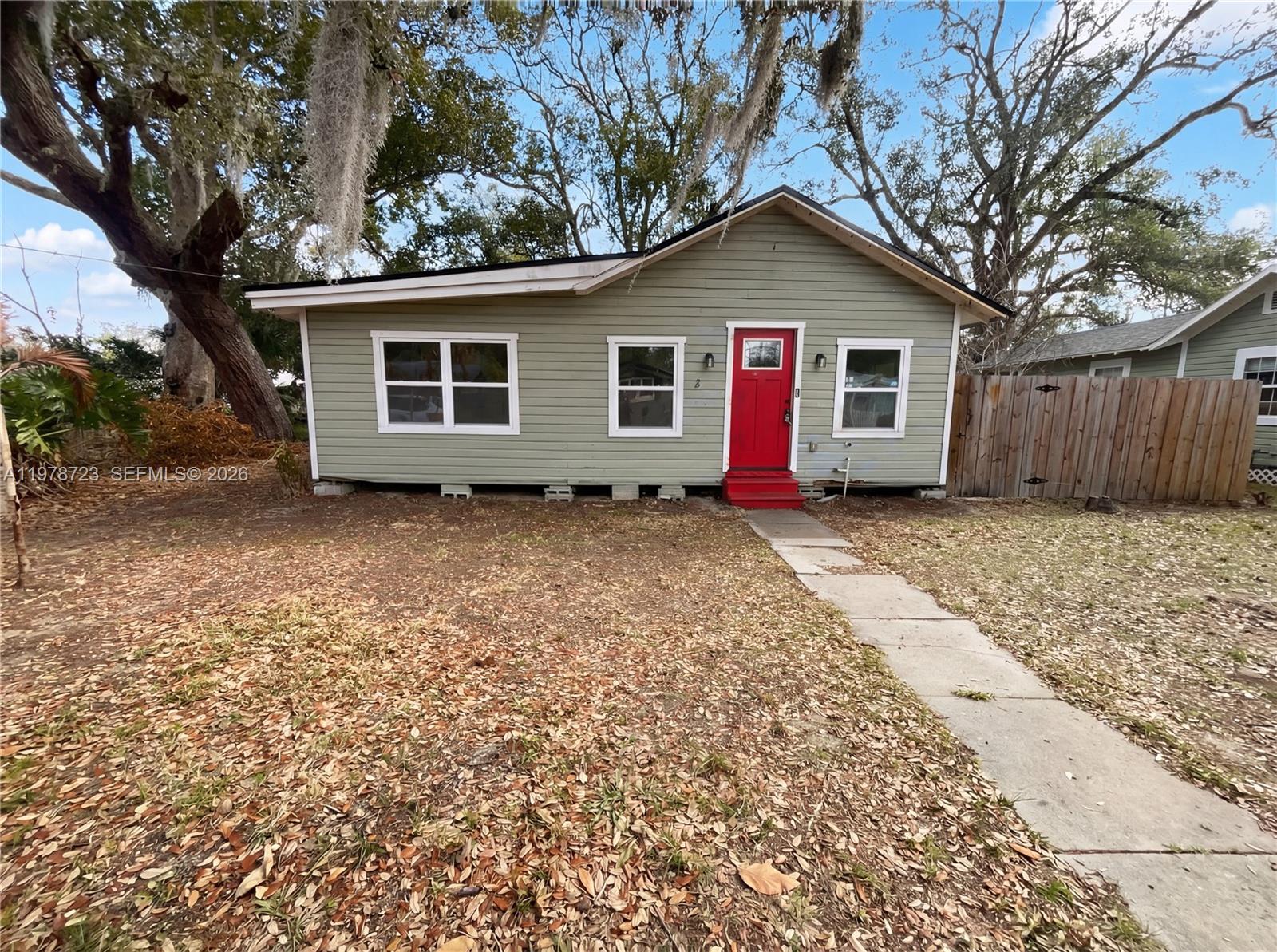244 South Rhodes Street Mount Dora, FL 32757 - Photo 5 of 19 a view of a house with a yard