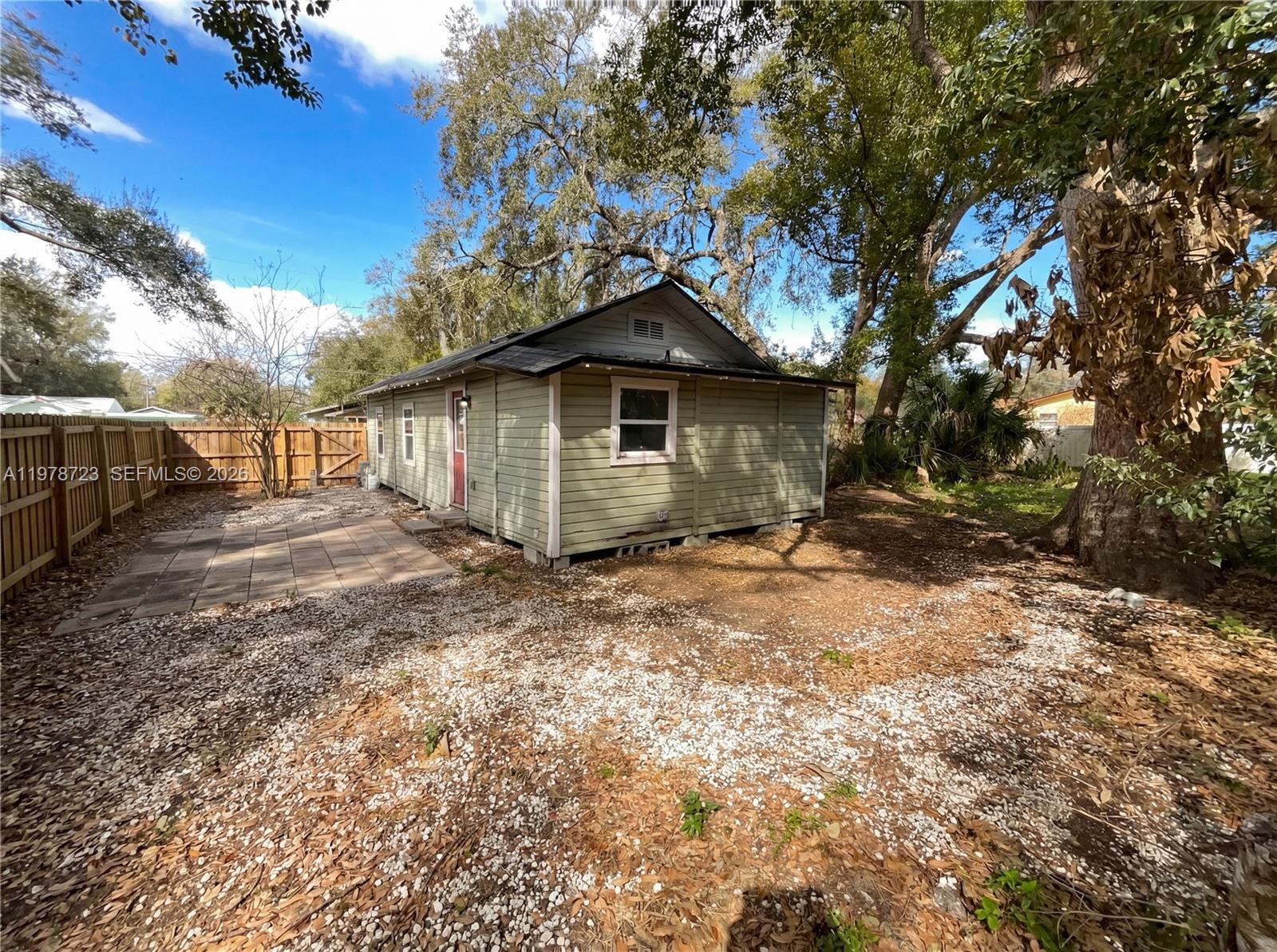244 South Rhodes Street Mount Dora, FL 32757 - Photo 7 of 19 a view of a house with a yard