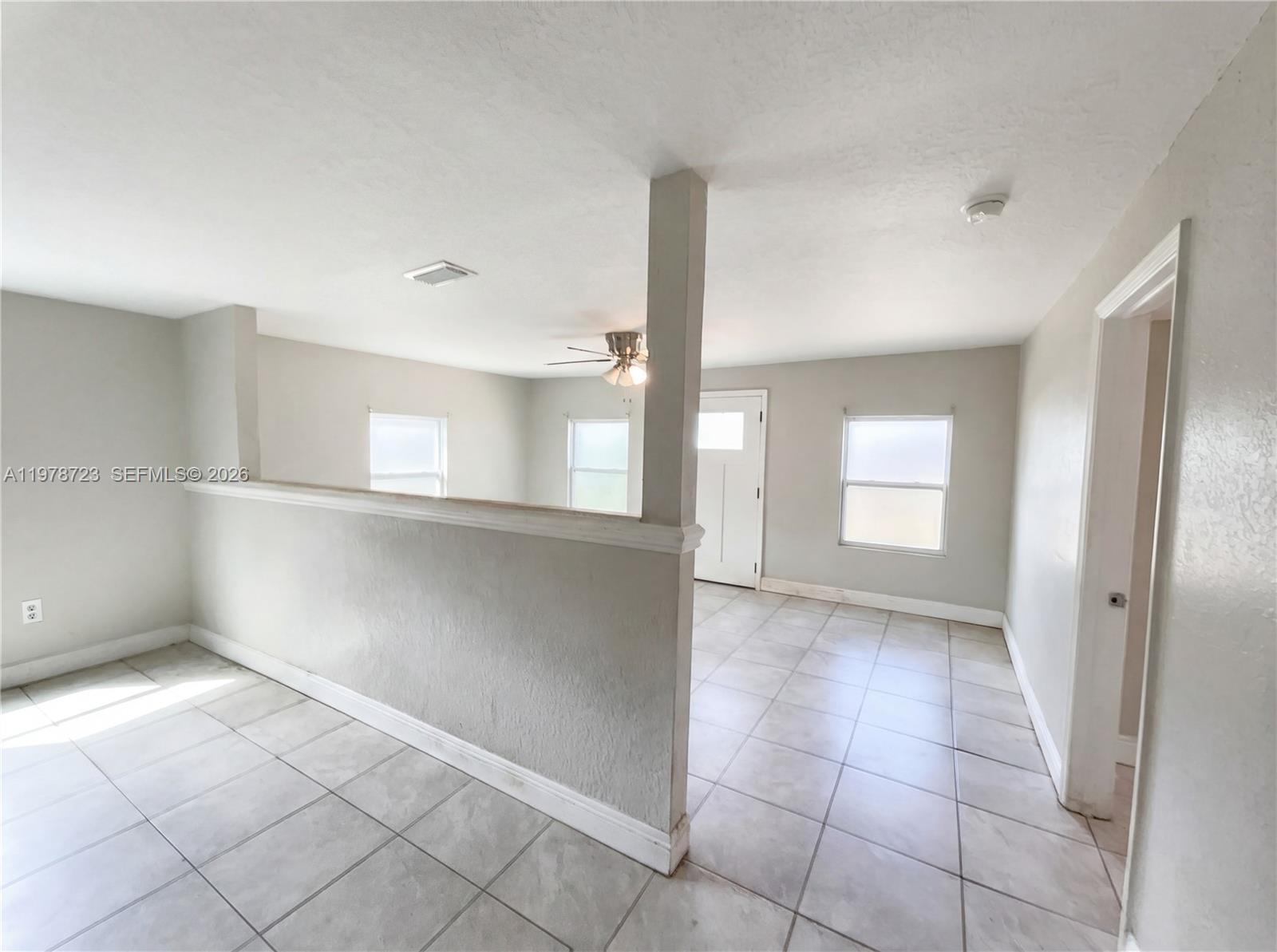 244 South Rhodes Street Mount Dora, FL 32757 - Photo 8 of 19 a view of an empty room and window