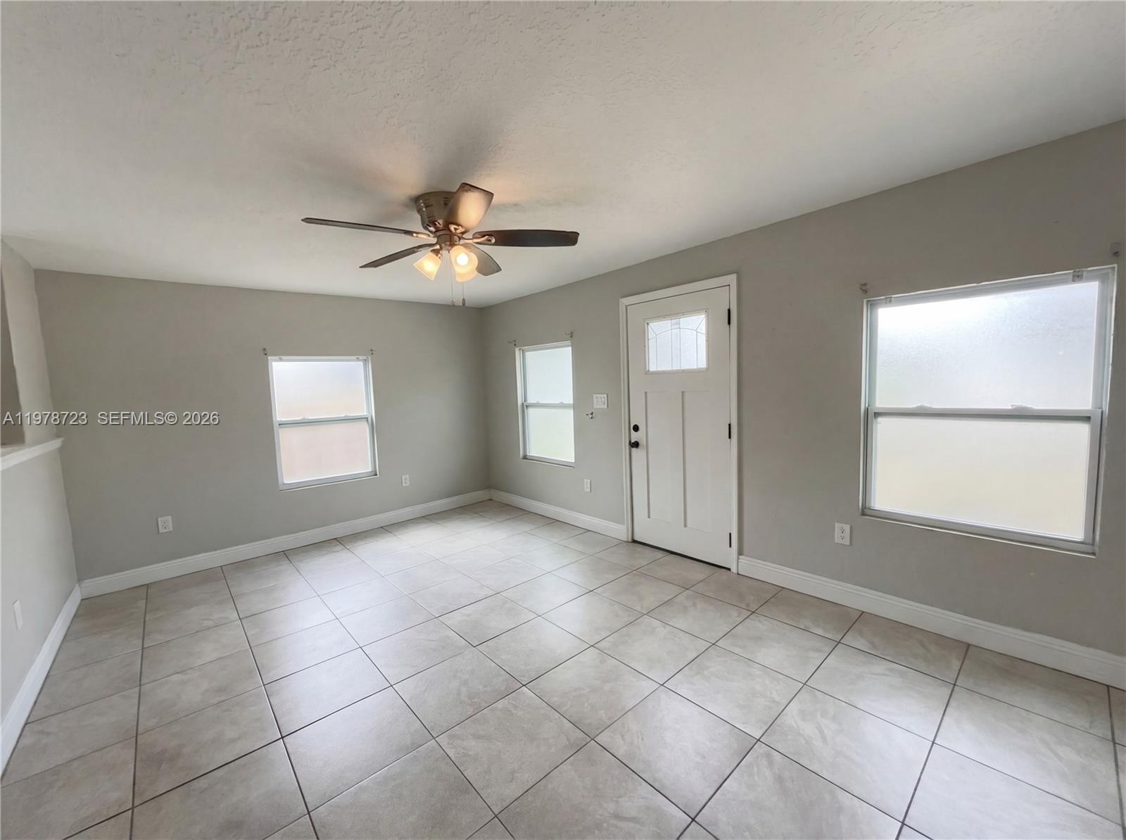 244 South Rhodes Street Mount Dora, FL 32757 - Photo 10 of 19 a view of an empty room with a window