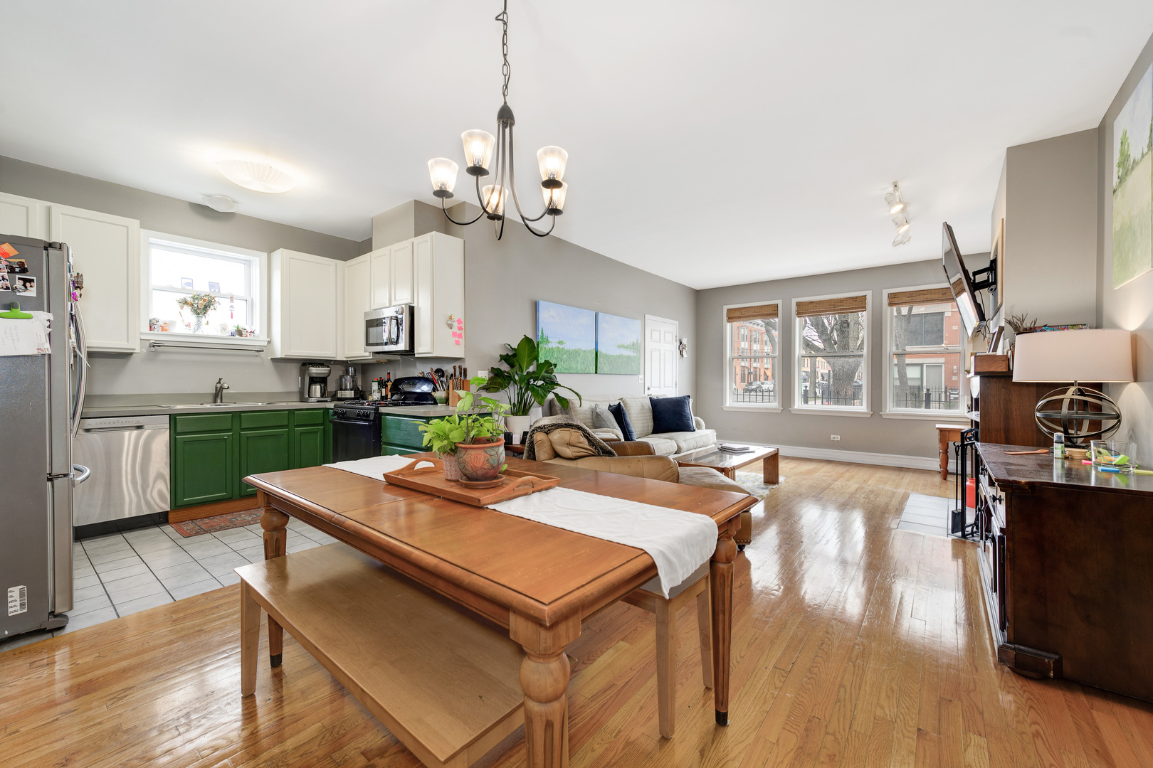1359 West Fillmore Street, Unit A Chicago, IL 60607 - Photo 7 of 19 a view of a dining room and livingroom with furniture wooden floor a chandelier