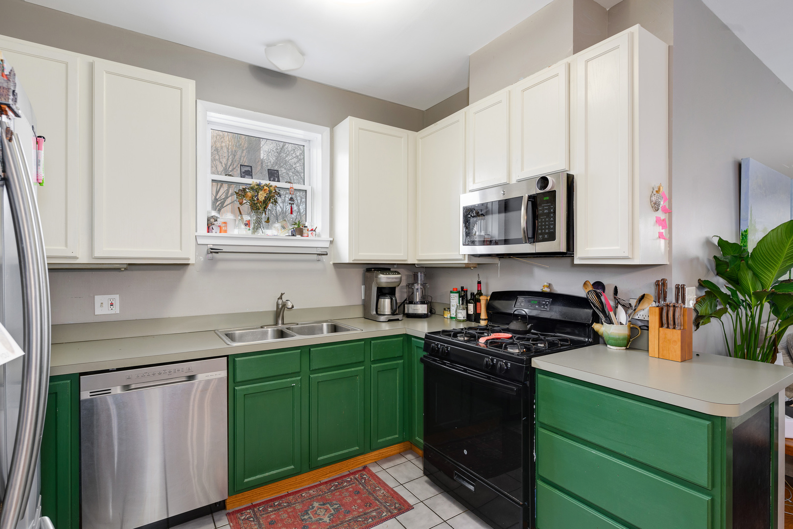 1359 West Fillmore Street, Unit A Chicago, IL 60607 - Photo 8 of 19 a kitchen with a sink stove and microwave