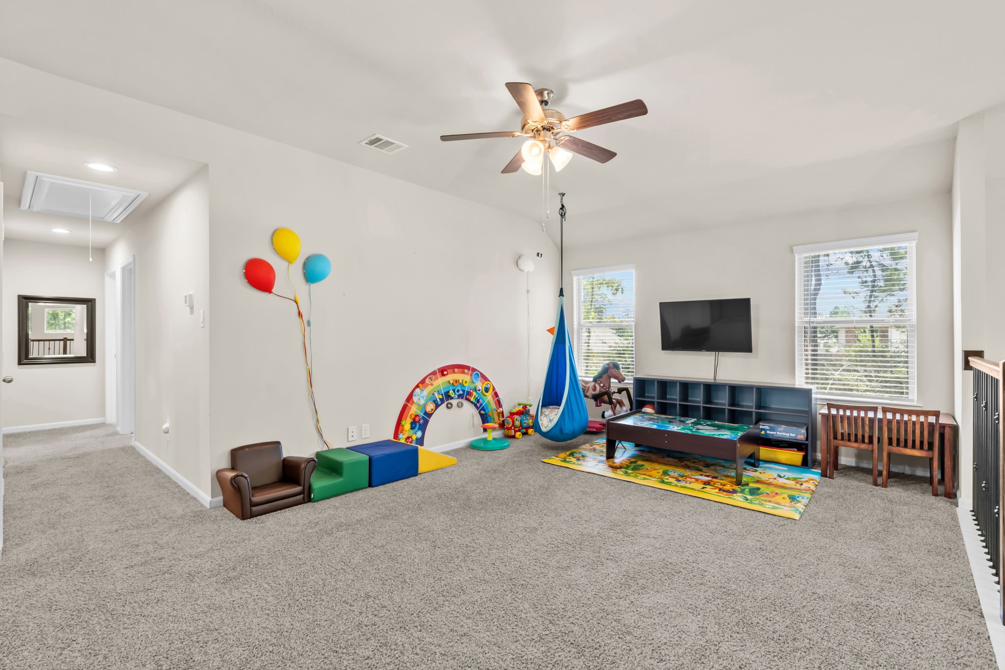 14388 Zion Gate Crossing Conroe, TX 77384 - Photo 21 of 33 a living room with furniture and a flat screen tv