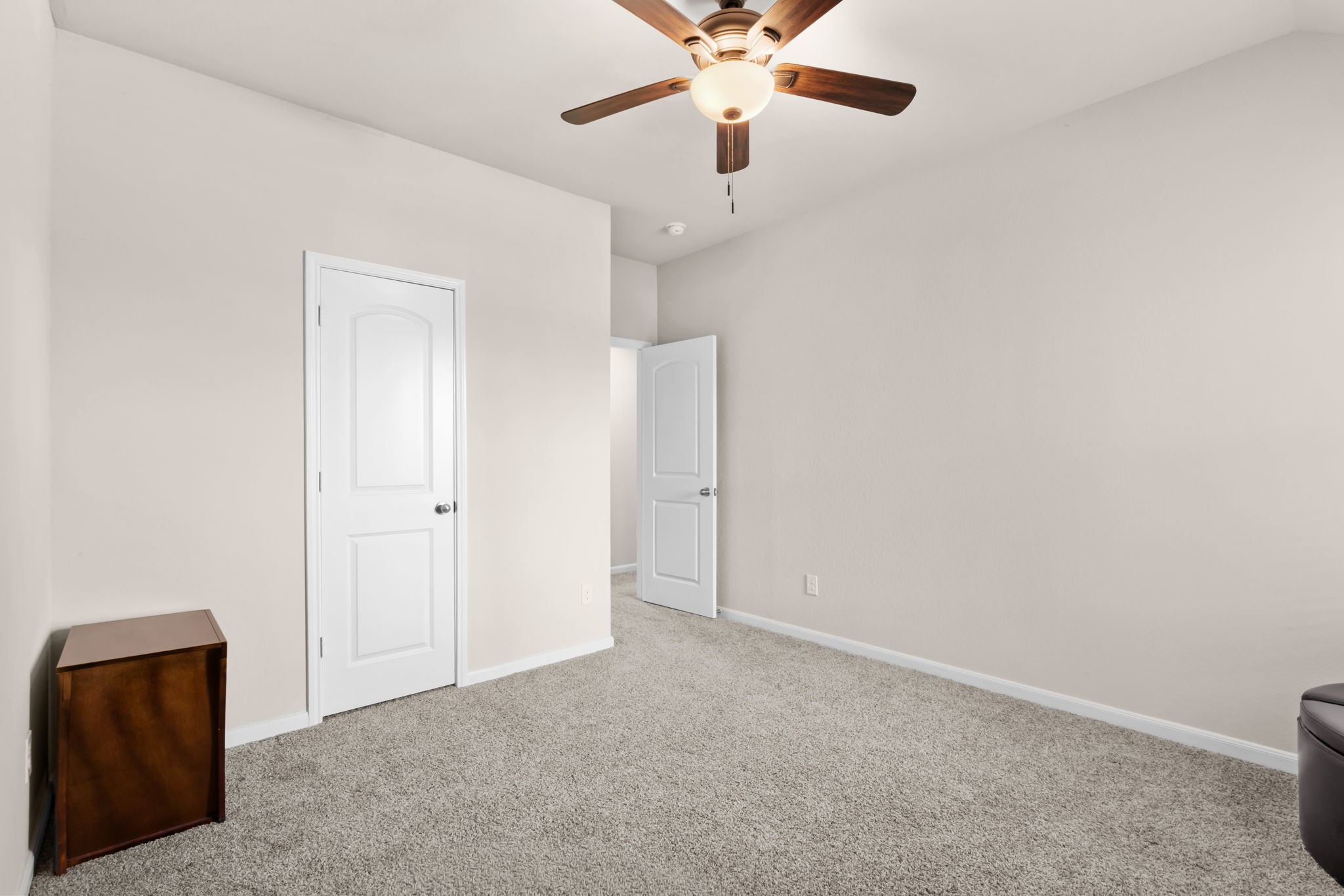 14388 Zion Gate Crossing Conroe, TX 77384 - Photo 26 of 33 an empty room with a ceiling fan and a window