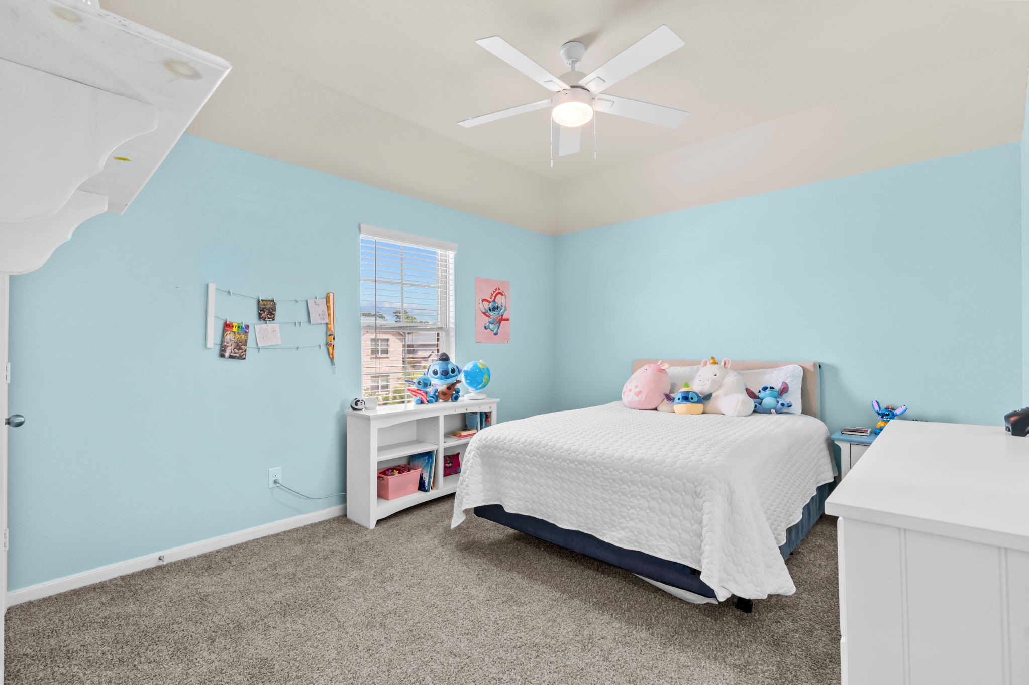 14388 Zion Gate Crossing Conroe, TX 77384 - Photo 28 of 33 a bedroom with a bed and a chandelier